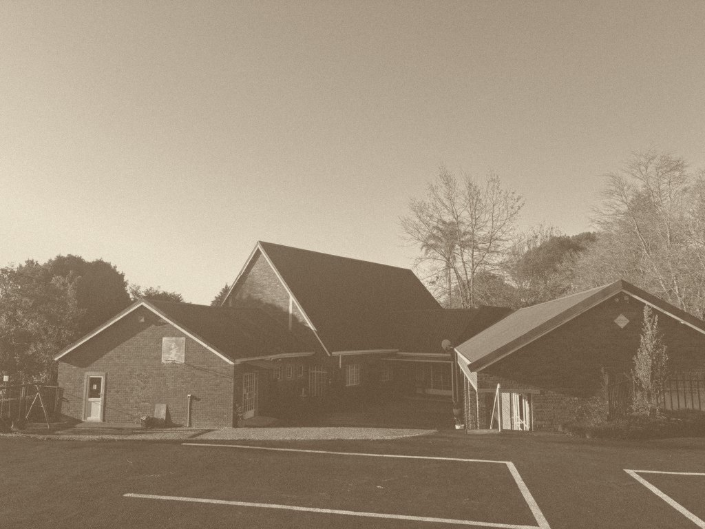 Christ Church Hilton's face-brick buildings and car park on Bergview Road