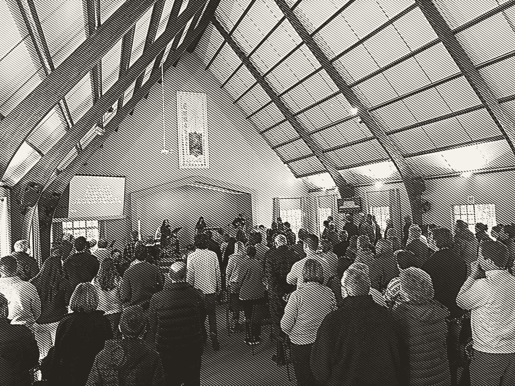 The congregation standing to sing under the timber trusses at Christ Church Hilton