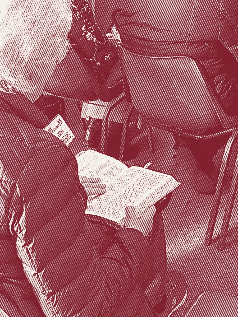 An open Bible on a lap during the service