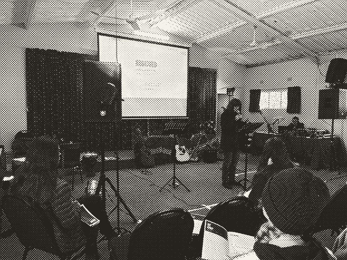 Young adults at an evening Bible study in the hall
